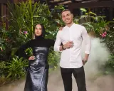 Two judges from MasterChef Dessert Masters Italia stand in front of a lush green backdrop with smoke effects.