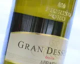 Close-up of a bottle of Gran Dessert Dolce wine, with "Fiorino D'Oro" visible at the top.