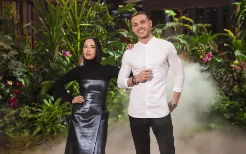 Two judges from MasterChef Dessert Masters Italia stand in front of a lush green backdrop with smoke effects.