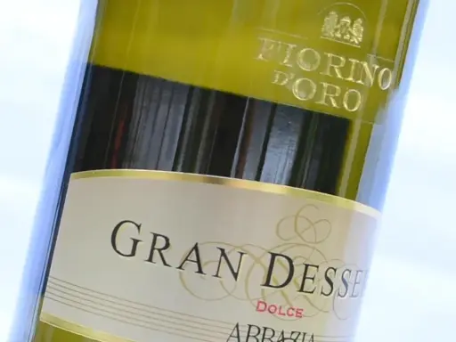 Close-up of a bottle of Gran Dessert Dolce wine, with "Fiorino D'Oro" visible at the top.
