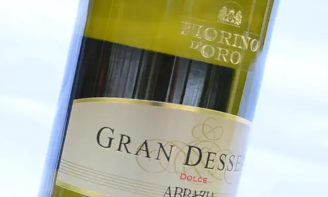 Close-up of a bottle of Gran Dessert Dolce wine, with "Fiorino D'Oro" visible at the top.