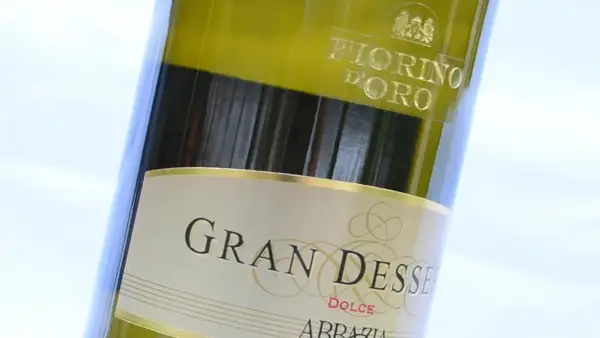 Close-up of a bottle of Gran Dessert Dolce wine, with "Fiorino D'Oro" visible at the top.